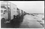 New Zealand ambulance convoy of 8th Army, immobilized by wet weather in Sidi Haneish, Egypt, during World War 2 - Photograph taken by Major Wilson