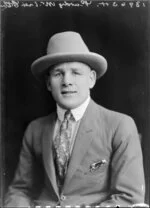 Mr C. Purdy in suit & hat