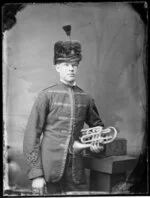 Unnamed bandsman, in uniform of Wanganui Rifle Volunteers, with cornet
