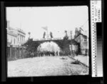Decorative arch for Queen Victoria's [Diamond ?] Jubilee on a street in Masterton, Wairarapa - Photograph taken by Albert Edward Winzenberg