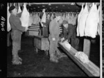 Telescoped lamb being moved from freezer, Westfield Freezing Works, Otahuhu, Auckland - Photograph taken by W Walker