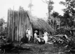 Group outside a timber camp hut