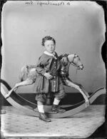 A Beauchamp, his son aged 2, by rocking horse