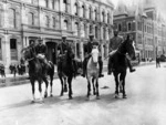Four of Massey's Special Constables on horseback, Customhouse Quay, Wellington