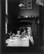 Edward, Frank and Doreen Gifford seated around a table