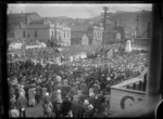 Crowd watching an Anzac Day parade on Courtenay Place, Wellington