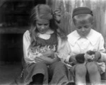 Dickson children holding kittens, Te Aroha
