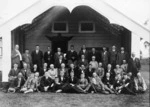 Group photograph of Savage Club members in front of an unidentified meeting house