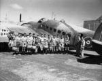 Row of boys next to a Lockheed Hudson aeroplane