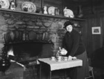 Dame Elizabeth Knox Gilmer making tea beside the fireplace in her Upper Hutt home Te Marua