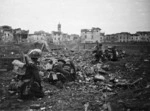 Kaye, George, b 1914 : New Zealand infantrymen approaching the blown bridge across the Lamone River, Italy