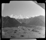 Paddocks and small town [Weheka?] with Mount Tasman in the backgound, West Coast Region