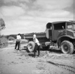Japanese prisoners of war loading sand from a Wairarapa riverbed on to a truck
