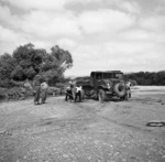 Japanese prisoners of war loading sand into a truck, Wairarapa