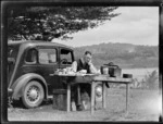 Robert Wells sitting at a table, Lake Rotoehu