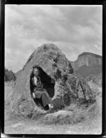 Zeila Wells sitting inside rock, Atiamuri