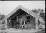 Kiharoa Akuhata and elder brother Eruera te Uremutu sitting outside the carved Maori house Tauwhitu at Ohinemutu