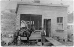 Group outside Dalzell's Butchery, Runanga, West Coast