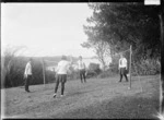 Four unidentified girls playing tennequoits