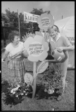 Levin Promotion Council deputy-chairwoman and a public relations officer, with flower shaped signs promoting the town of Levin - Photograph taken by Stuart Ramson