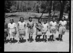 Pupils from Ngatangiia School, Rarotonga, Cook Islands, with baskets they had made - Photograph taken by W Walker