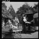 Children from the Wilson Home for crippled children, about to go to hospital by ambulance, for special treatment, Takapuna, Auckland