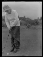 Participant in Ladies Golf Tournament at Heretaunga, New Zealand v Great Britain, with a putter