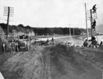 Workmen widening a road in Porirua