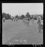 Male cyclists racing at an athletics event, Maidstone Park, Upper Hutt