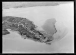 The southern Hokianga Harbour peninsula town of Rawene with Parnell Street and Wharf in foreground, looking to the Omanaia River Estuary beyond, Northland Region