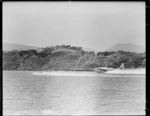 The speedboat Redhead racing the flying boat Ararangi, Evans Bay, Wellington