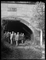 Group of men outside the Wainuiomata tunnel