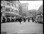 Brass band marching in Mercer Street, Wellington