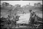 New Zealand infantry advancing on Faenza making their way across the Lamone River, Italy, during World War II - Photograph taken by George Kaye