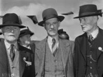 Three men at a reunion of Mount Cook School