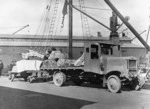 [Marble for Parliament Buildings being loaded on to a Hansford & Mills Ltd lorry at Wellington wharves]