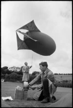 Meteorologists Dr D C Thompson and Mr J C Hickman testing a kytoon, Anderson Park, Wellington