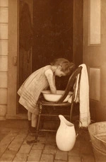 Young girl having a wash