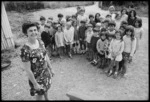 Children of Matauranga School present a dress to the Headmistress