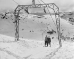 Skiers by the T Bar tow, Staircase slopes, Mount Ruapehu - Photograph taken by Edward Percival Christensen