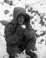 Gunner Bob Ross with a mug of cocoa in wintry conditions, Korea