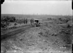 A motor car passing a huge shell hole in captured ground, Grevillers, World War I