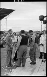 Her Majesty Queen Elizabeth II and Philip, Duke of Edinburgh, talking to champion shearers, the Bowen Brothers, McLean Park, Napier - Photograph taken by E P Christensen