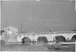 Rimini, Italy, during World War II, showing a Roman bridge across the Marecchia River - Photograph taken by George Kaye