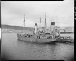 Fishing trawler Phyllis being towed to Evans Bay patent slip, Wellington - Photograph taken by W Walker