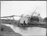 Dredge on Awanui river, during drainage project on the the Kaitaia swamp
