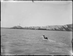 Cape Campbell, Marlborough, with launch towing in surf boat to land stores