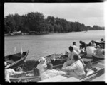 Spectators in punts at the Royal Henley Peace Regatta, England