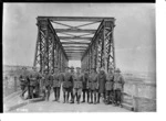 New Zealand engineers with the iron bridge that they designed and built