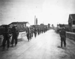 Pritchard, G E, fl 1945 : Members of 8th Platoon, B Company, 25th Battalion, marching near Massa Lombarda, Italy